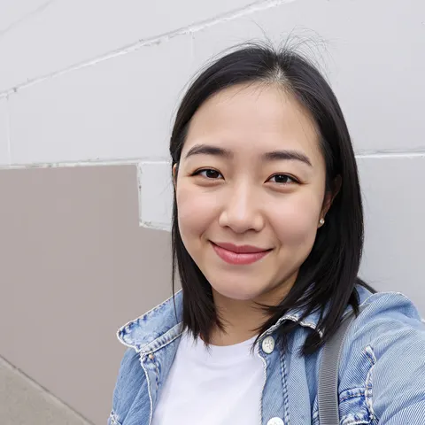 The original selfie: a smiling woman in a denim jacket
